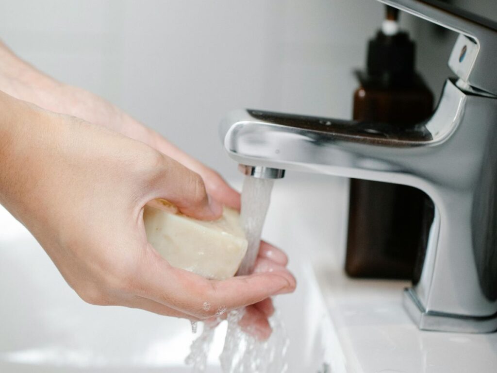 Handwashing with clean water - requires backflow-free systems.
